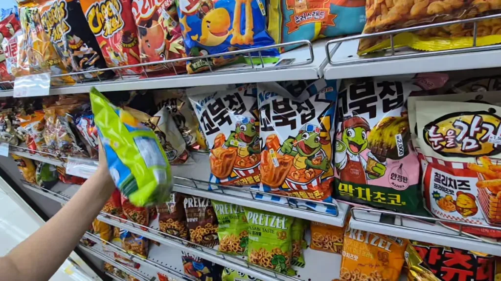 Korean Turtle Chips and other snacks displayed on a shelf at Daiso.